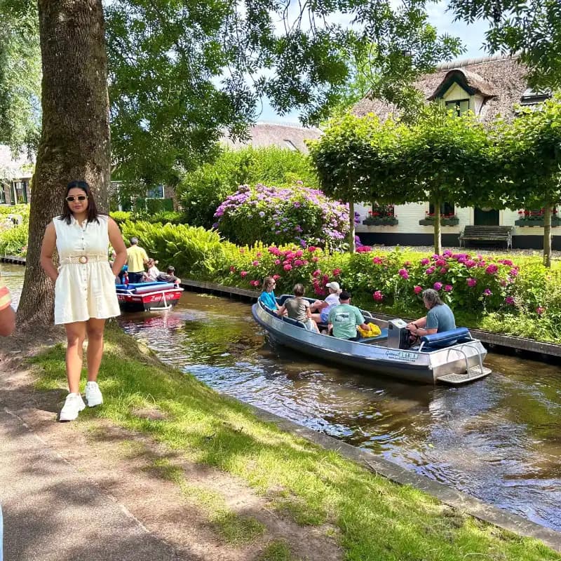 Tourists enjoying a boat ride through Giethoorn's picturesque canals